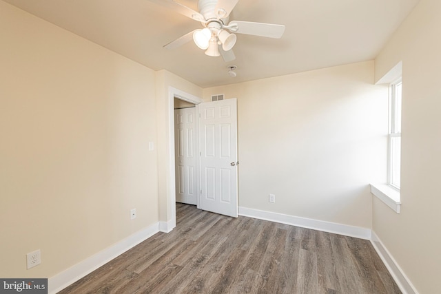 unfurnished bedroom featuring hardwood / wood-style flooring and ceiling fan