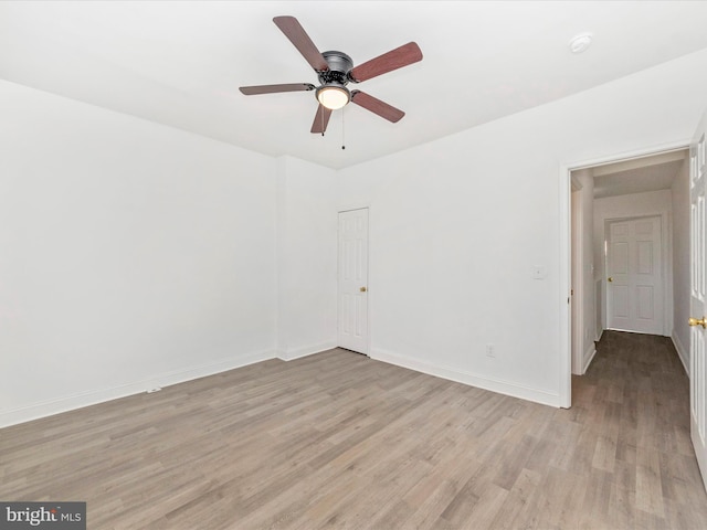 unfurnished room featuring light hardwood / wood-style floors and ceiling fan