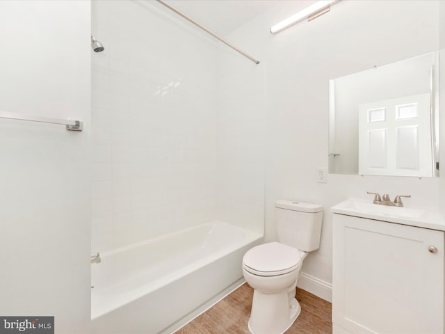 full bathroom featuring vanity, toilet, tiled shower / bath combo, and wood-type flooring