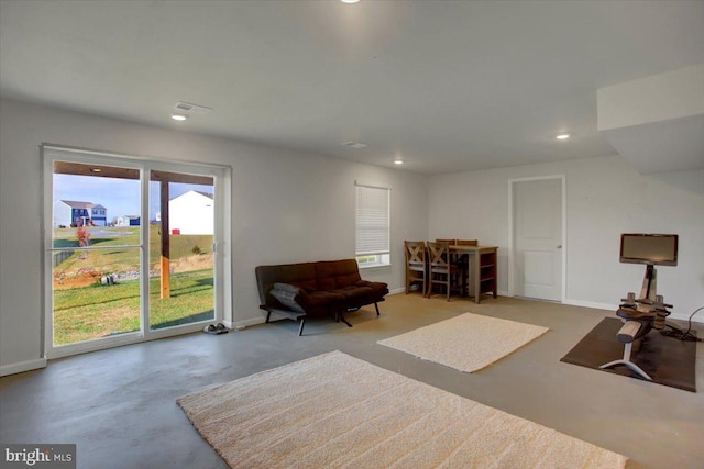 sitting room featuring concrete flooring