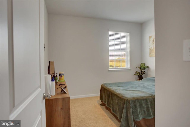 bedroom featuring light carpet