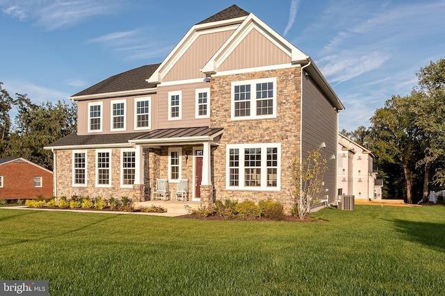 craftsman house featuring central AC and a front lawn