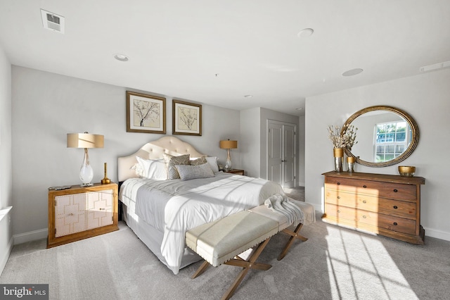 bedroom with light colored carpet