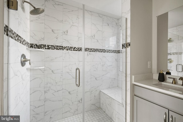 bathroom featuring vanity and an enclosed shower