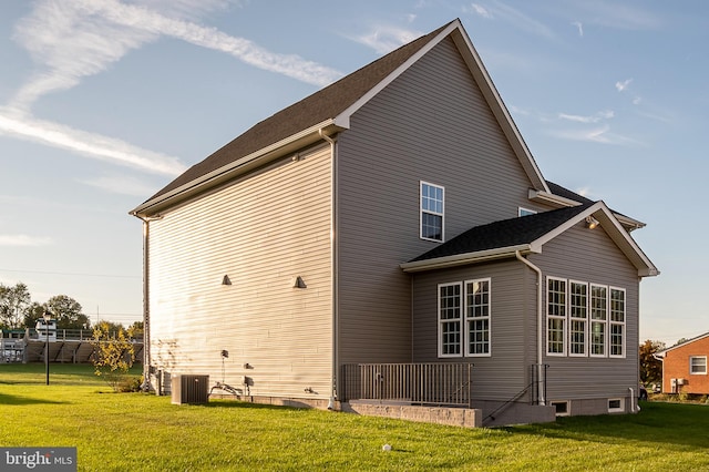 view of side of home with a lawn