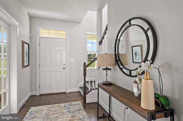 entryway with dark hardwood / wood-style floors