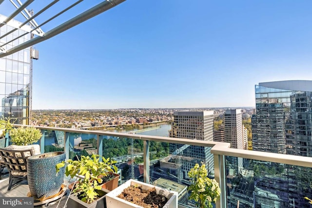 balcony featuring a water view