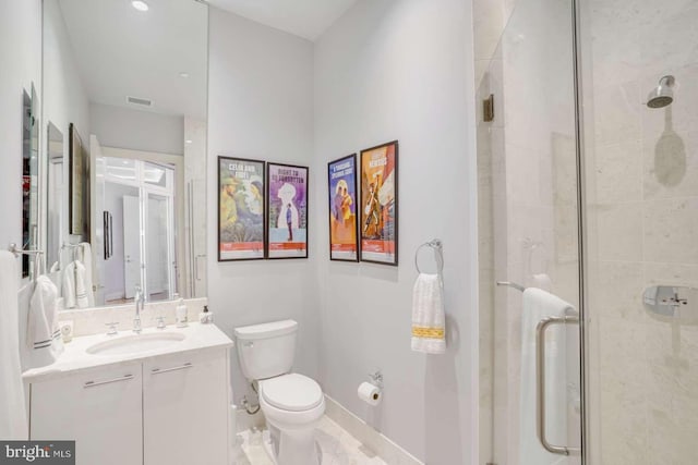 bathroom with toilet, tile patterned flooring, vanity, and a shower with door