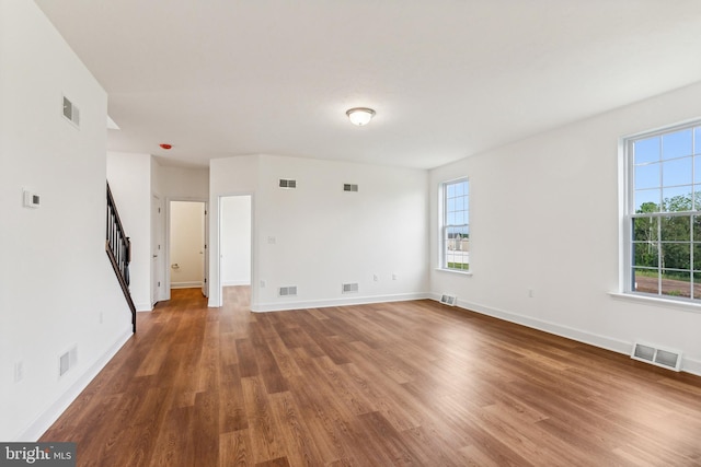 unfurnished room featuring hardwood / wood-style flooring