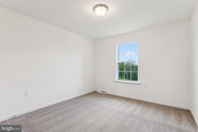 empty room featuring carpet flooring