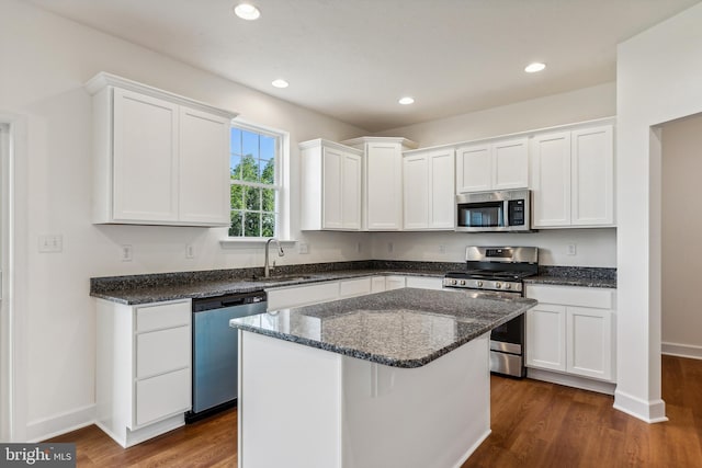 kitchen featuring appliances with stainless steel finishes, sink, and white cabinets