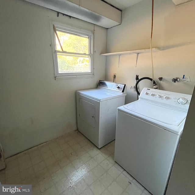 clothes washing area featuring washer and clothes dryer