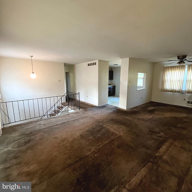 unfurnished room with ceiling fan