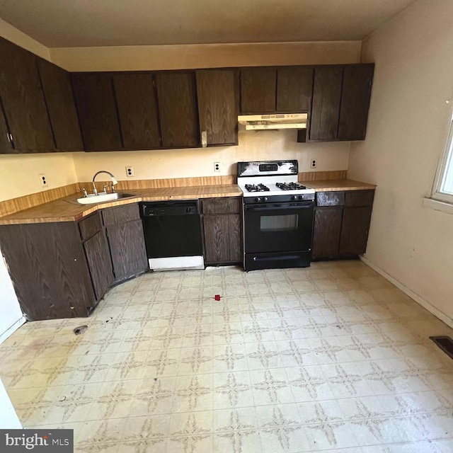 kitchen with dark brown cabinets, black appliances, and sink