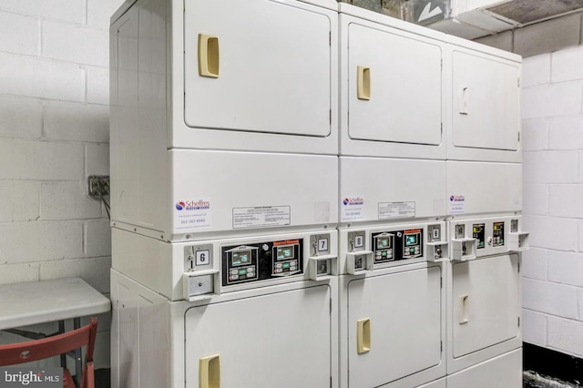 washroom featuring washing machine and clothes dryer and stacked washer and dryer