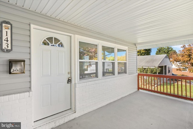 doorway to property with a porch