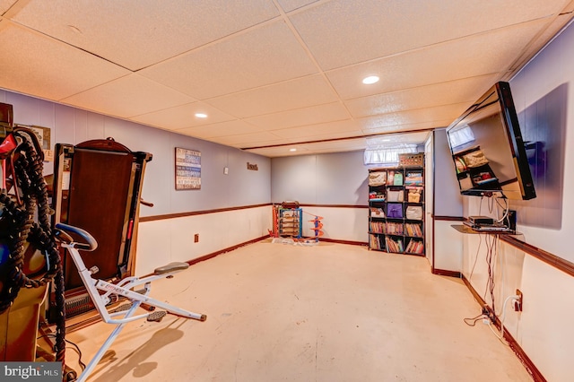 workout area with a paneled ceiling