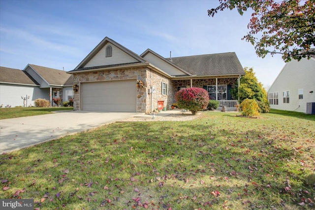 ranch-style house with central AC, a front yard, and a garage