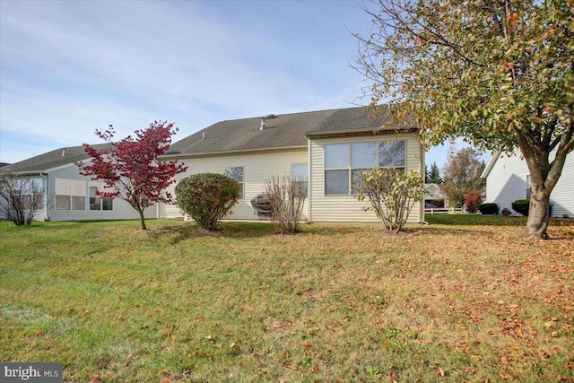 view of home's exterior featuring a yard