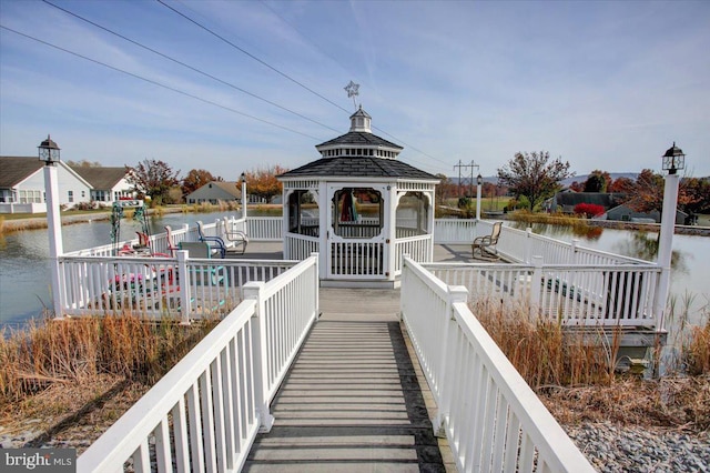 dock area with a water view and a gazebo