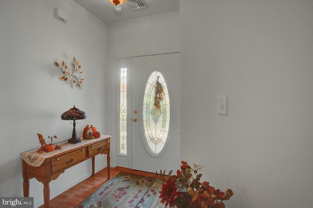 foyer entrance with light wood-type flooring