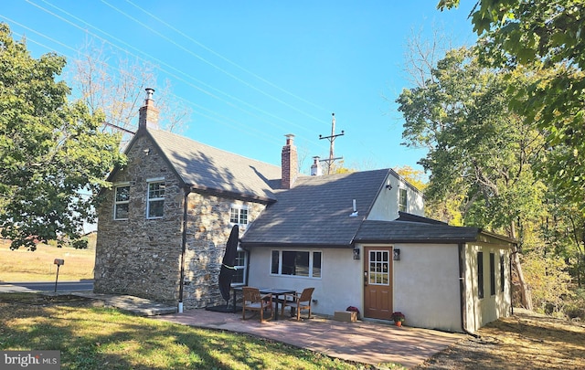 rear view of property with a patio