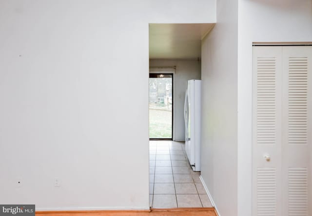 hallway with light tile patterned flooring