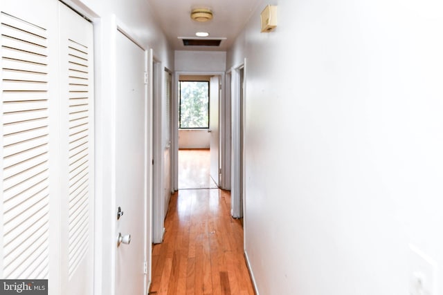 hallway featuring light hardwood / wood-style flooring