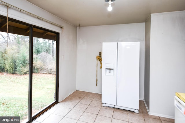 unfurnished room featuring light tile patterned floors