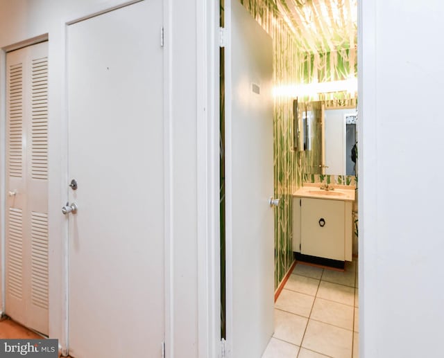 bathroom with tile patterned flooring and vanity