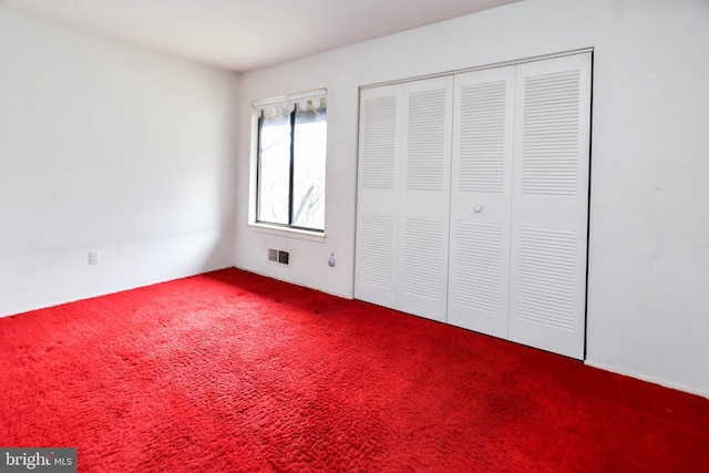 unfurnished bedroom featuring carpet