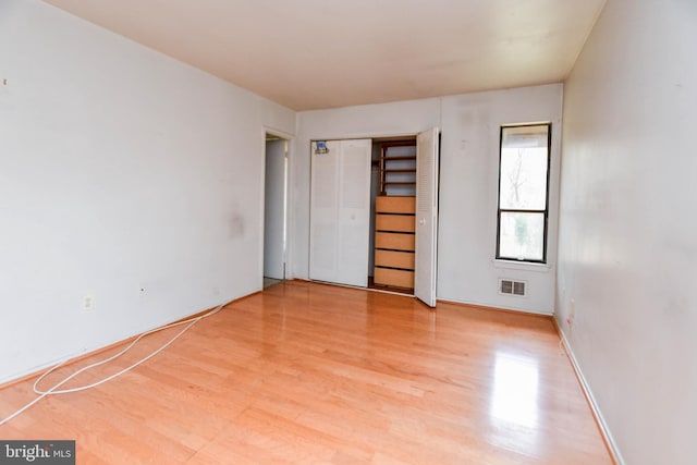 unfurnished bedroom featuring light wood-type flooring