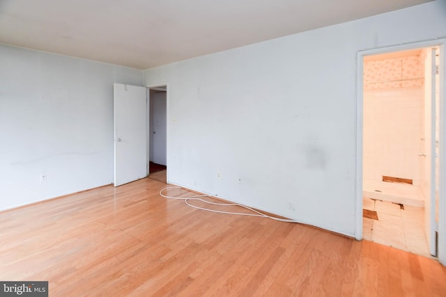 empty room with light hardwood / wood-style floors