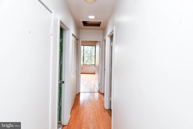 hallway with light wood-type flooring