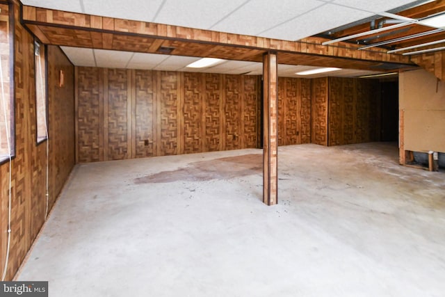 basement featuring a paneled ceiling