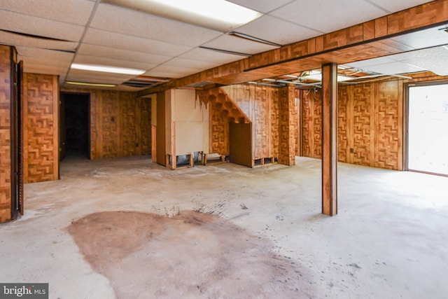 basement featuring a paneled ceiling