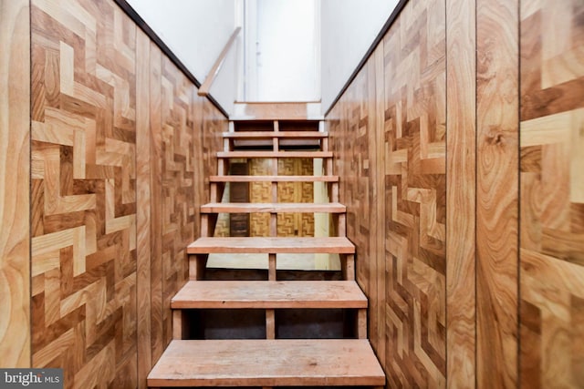 stairs with wood walls