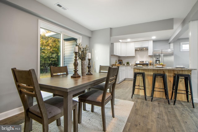 dining space featuring light hardwood / wood-style flooring