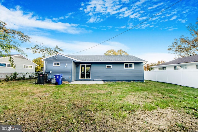 back of property featuring a yard and a patio