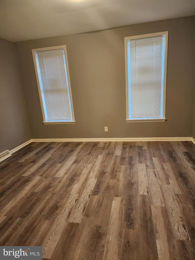 unfurnished room featuring hardwood / wood-style floors