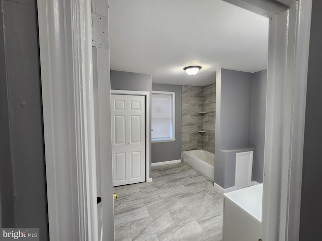 bathroom featuring vanity and tiled shower / bath combo