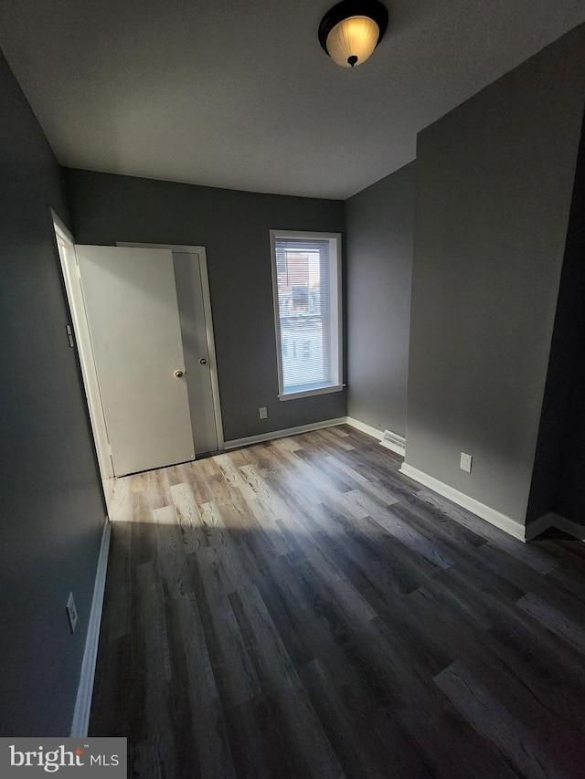 unfurnished room featuring hardwood / wood-style floors