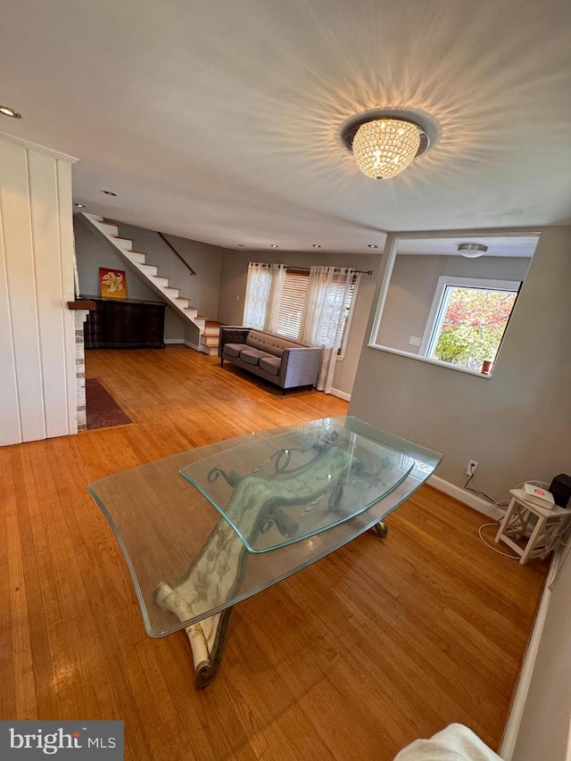 living room featuring hardwood / wood-style floors and a chandelier