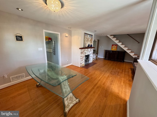 living room featuring a chandelier and hardwood / wood-style flooring