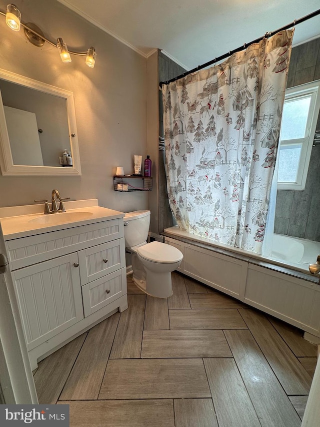 full bathroom with toilet, vanity, shower / bath combo, and ornamental molding