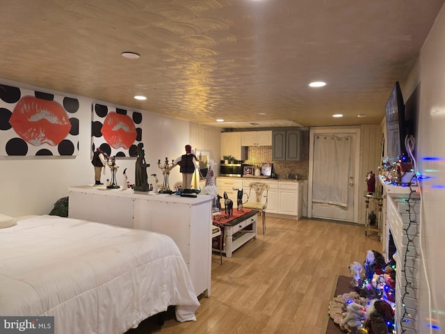 bedroom with light wood-type flooring