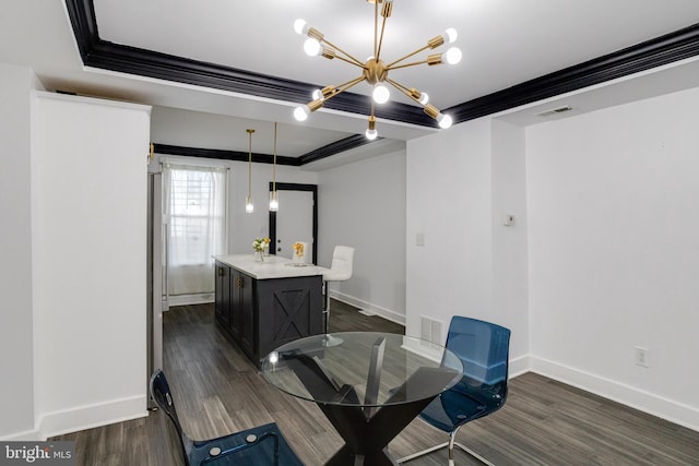 1107 S Carey St, Baltimore, MD 21223 - dining room with a chandelier, dark wood finished floors, a tray ceiling, and baseboards
