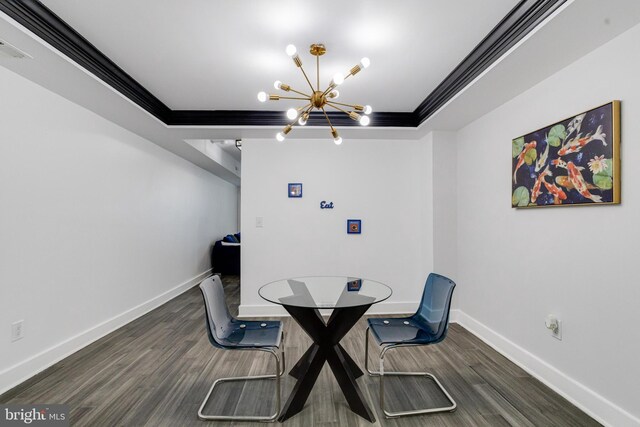 1107 S Carey St, Baltimore, MD 21223 - dining area with ornamental molding, a chandelier, wood finished floors, and baseboards