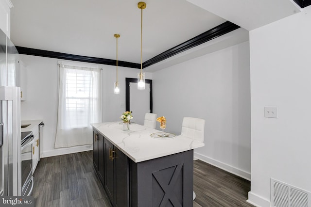 1107 S Carey St, Baltimore, MD 21223 - kitchen featuring dark wood finished floors, stainless steel range with electric cooktop, baseboards, a kitchen island, and hanging light fixtures