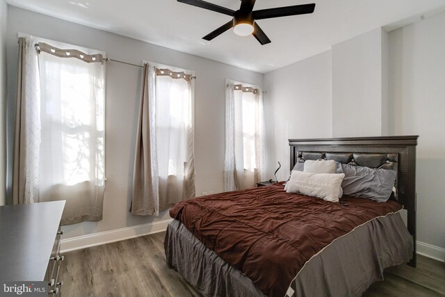 1107 S Carey St, Baltimore, MD 21223 - bedroom featuring wood finished floors, baseboards, and a ceiling fan